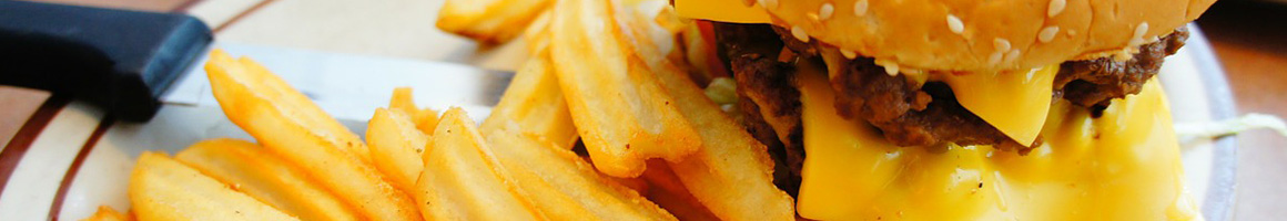 Eating Burger Chicken Wing Pub Food at Foghorn's Springdale restaurant in Springdale, AR.